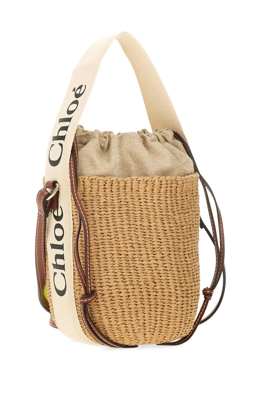 Beige woven straw chloé bucket bag with cream shoulder strap and brown leather accents for women