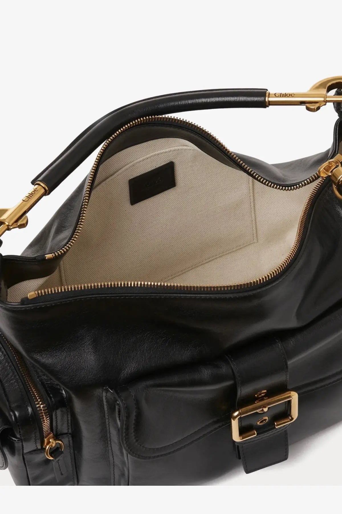 Black leather Chloé women’s carry shiny buffalo leather shoulder bag with gold-tone hardware and beige interior lining