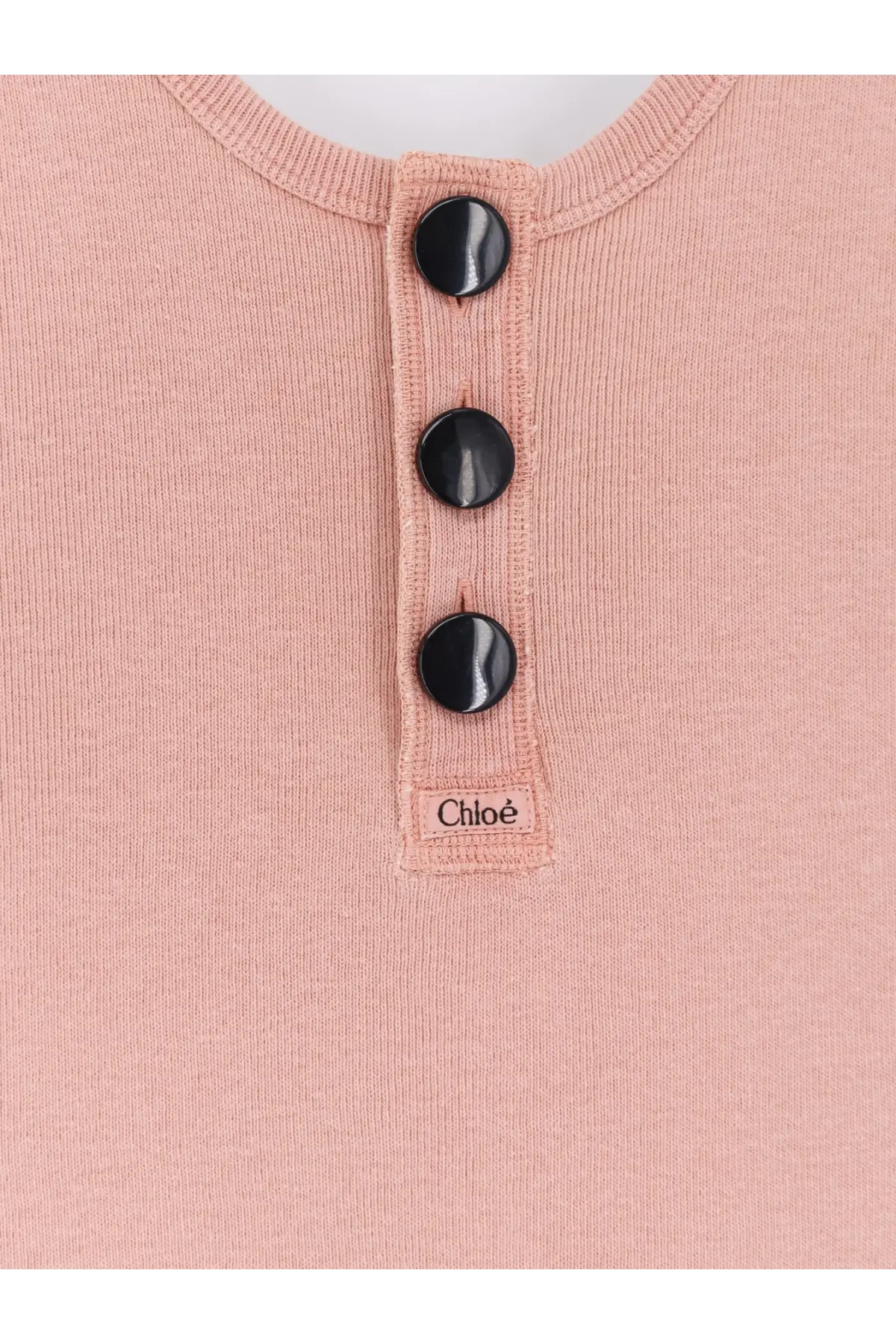 Chloé women’s beige cotton tank top with soft pink ribbed knit fabric and three glossy black buttons at neckline