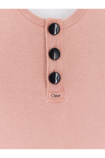Chloé women’s beige cotton tank top with soft pink ribbed knit fabric and three glossy black buttons at neckline