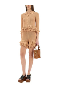 Beige crocheted two-piece set with ruffled hem and collar featuring chloé women’s crochet knit mini shorts beige