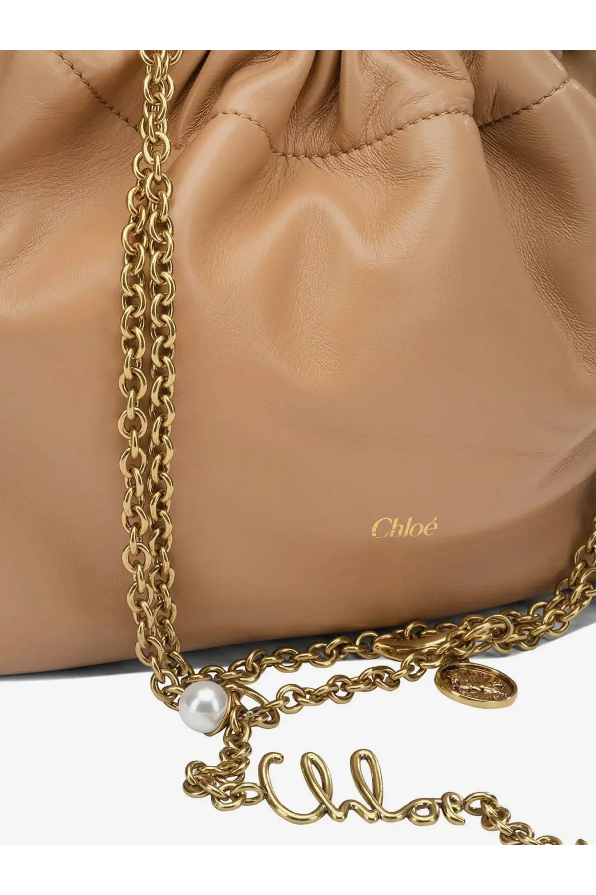 Beige leather drawstring Chloé crossbody bag with gold-tone chain strap featuring pearl and coin charms