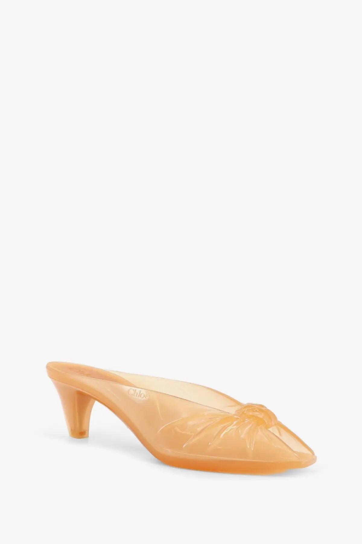 Chloé women’s transparent peach-colored jelly tpu mule sandals with molded bow detail at the toe in brown