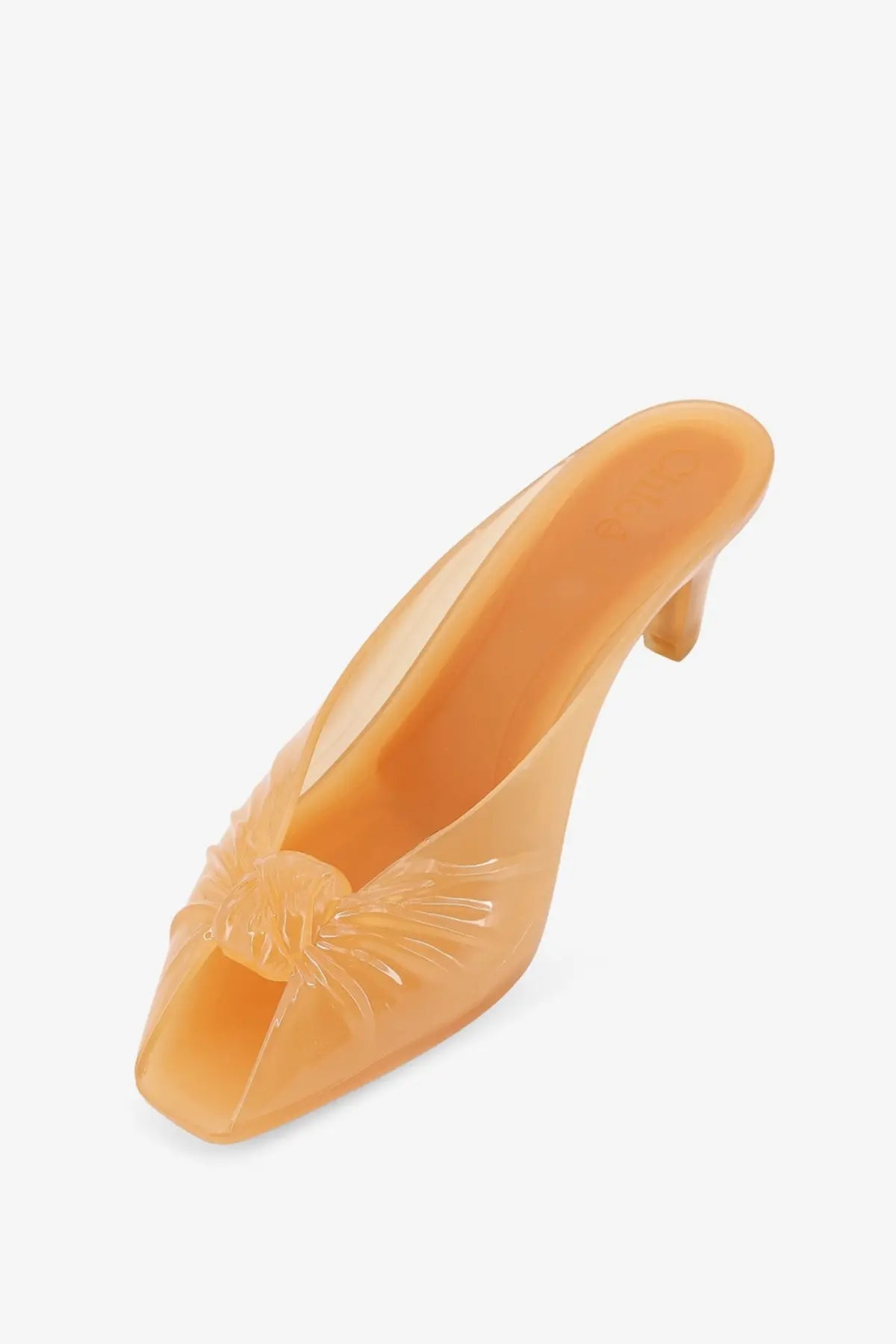 Chloé women’s jelly tpu mule sandal in transparent peach with molded bow detail at the toe brown color