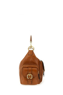 Chloé women’s beige leather camera bag with brown leather shoulder strap and gold-tone buckle flap closure
