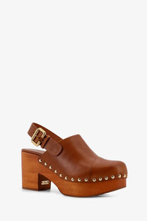 Brown leather clog with wooden block heel and gold-tone studs along toe from Chloé women’s jeanette sabot collection