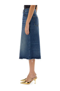 The back of chloé women’s patchwork denim bermuda shorts in medium blue with two back pockets and a frayed hem