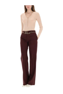 Burgundy wide-leg trousers with a silver chloé logo chain belt paired with blue ribbed knit top for women