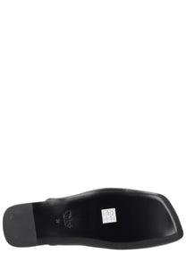 Black leather sole with glossy finish and embossed logo on the back of chloé women’s sabot rita black shoe