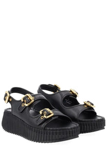 Chloé women’s black leather platform sandals with gold-tone buckle straps for stylish summer wear