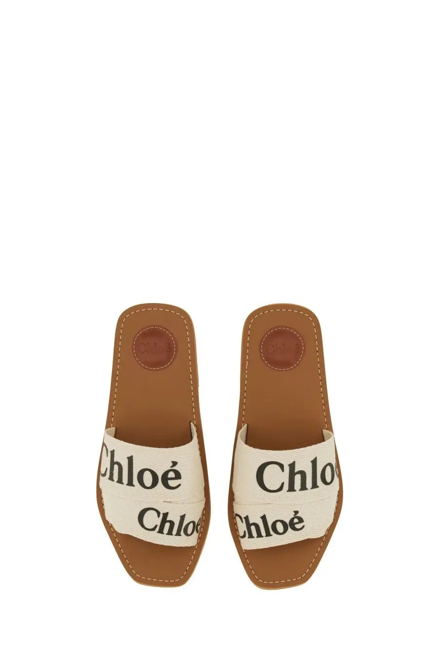 Cream-colored canvas slide sandals with brown leather accents and chloé branding for women woody white model