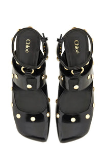Chloé women’s black patent leather platform sandals with gold-tone studs and circular hardware details