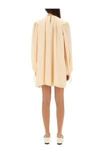 Beige silk long-sleeved mini dress by Chloé with puffed sleeves and side ties for elegant occasions