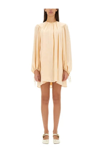 Chloé women’s silk shirred mini dress in soft beige with puffed long sleeves and gathered neckline