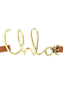 Chloé women’s small belt with gold-tone metallic buckle featuring cursive logo on tan leather strap in beige