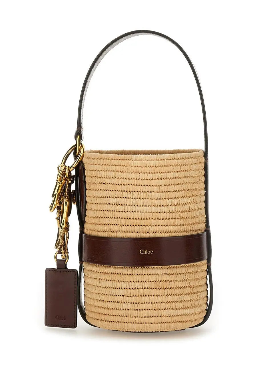 Beige straw bucket bag with dark brown leather strap and gold hardware featuring chloé brand name embossed on side