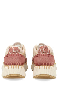 Chloé women’s sneaker nama beige with pink and cream textured woven upper and chunky rubber sole in front view