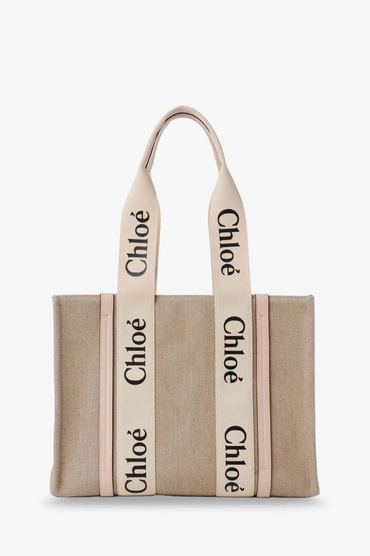 Beige canvas chloé tote bag with cream handles and black lettering in the style of woody linen shoulder bag blue
