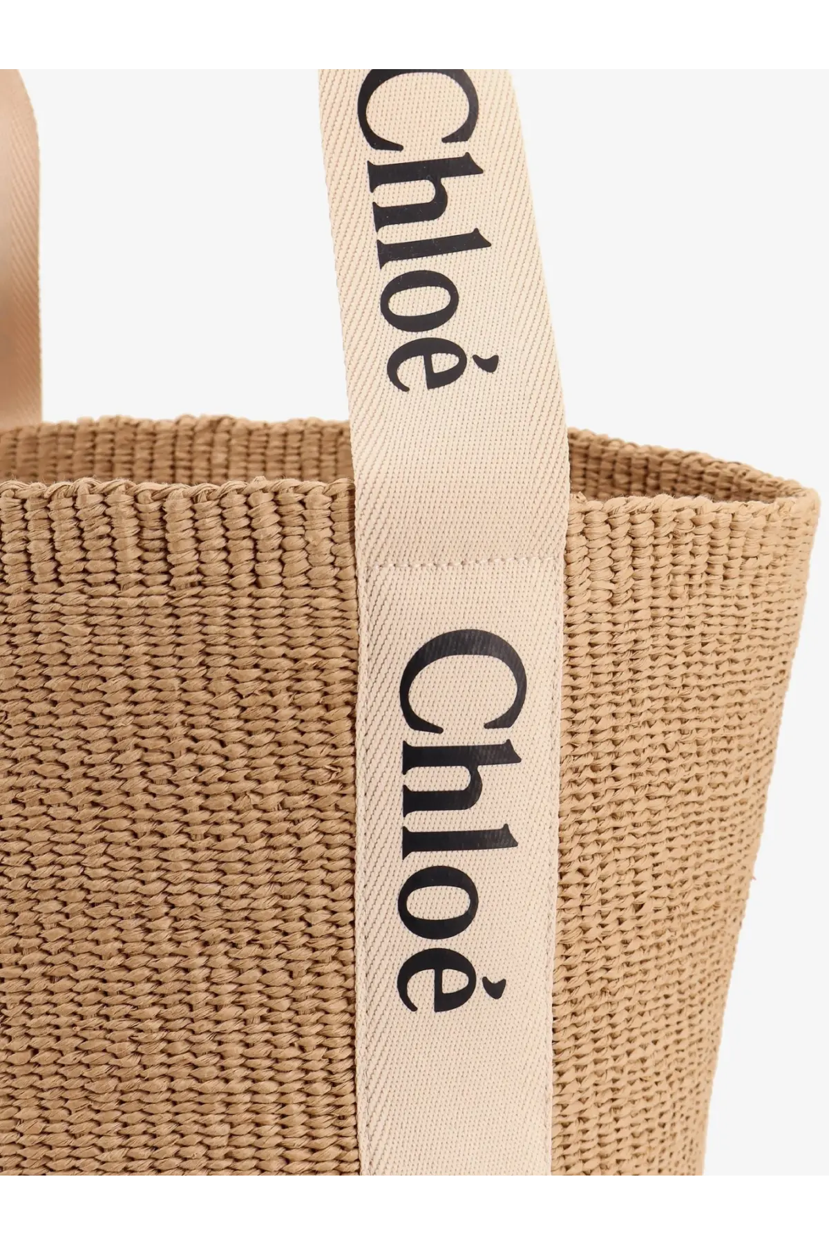 Beige woven straw tote bag with cream fabric handles and black chloé branding for women by chloé woody raffia shoulder bag white