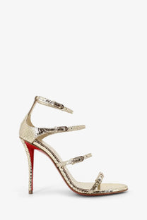 Christian Louboutin women’s millenium python leather sandal in gold with gold snake print strappy design and red sole