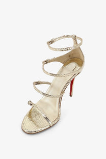 Christian Louboutin women’s Millenium python leather strappy high-heeled sandal in gold with signature red sole