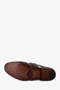 Brown leather Church’s men’s Shangai Flex loafers with stitched seam and small logo on the sole