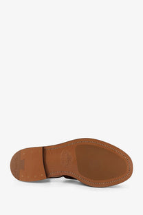 Brown leather sole with stitched edges and embossed churchs logo on orange suede fisherman sandals for men