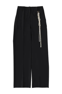 Black high-waisted wide-leg tailored pants with a silver crystal chain detail on the side seam by Circus Hotel
