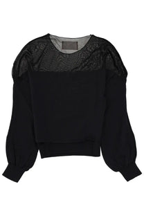 Black blouse with sheer patterned mesh shoulders and puffed sleeves from Circus Hotel women’s top collection