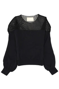Circus Hotel women’s black blouse with sheer patterned mesh sleeves and solid fabric body front view