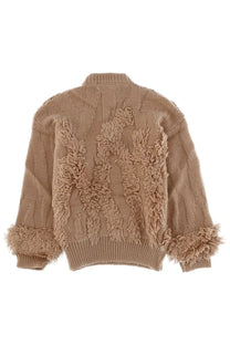 Beige wool blend knit sweater with textured cable patterns and fluffy fringed embellishments on back and cuffs shown from back