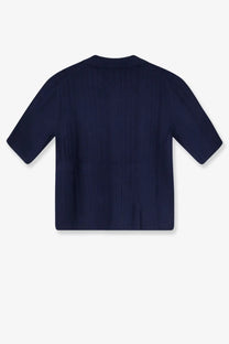 Navy blue short-sleeved polo shirt with rounded neckline and subtle vertical pleats made of cashmere and wool