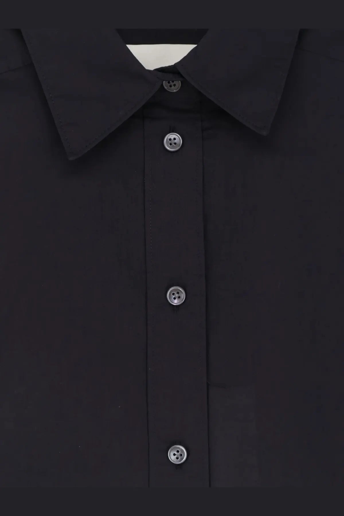 Closed women’s black cotton shirt with silver-toned buttons and a crisp collar perfect for casual or formal wear