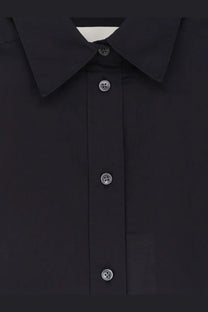 Closed women’s black cotton shirt with silver-toned buttons and a crisp collar perfect for casual or formal wear