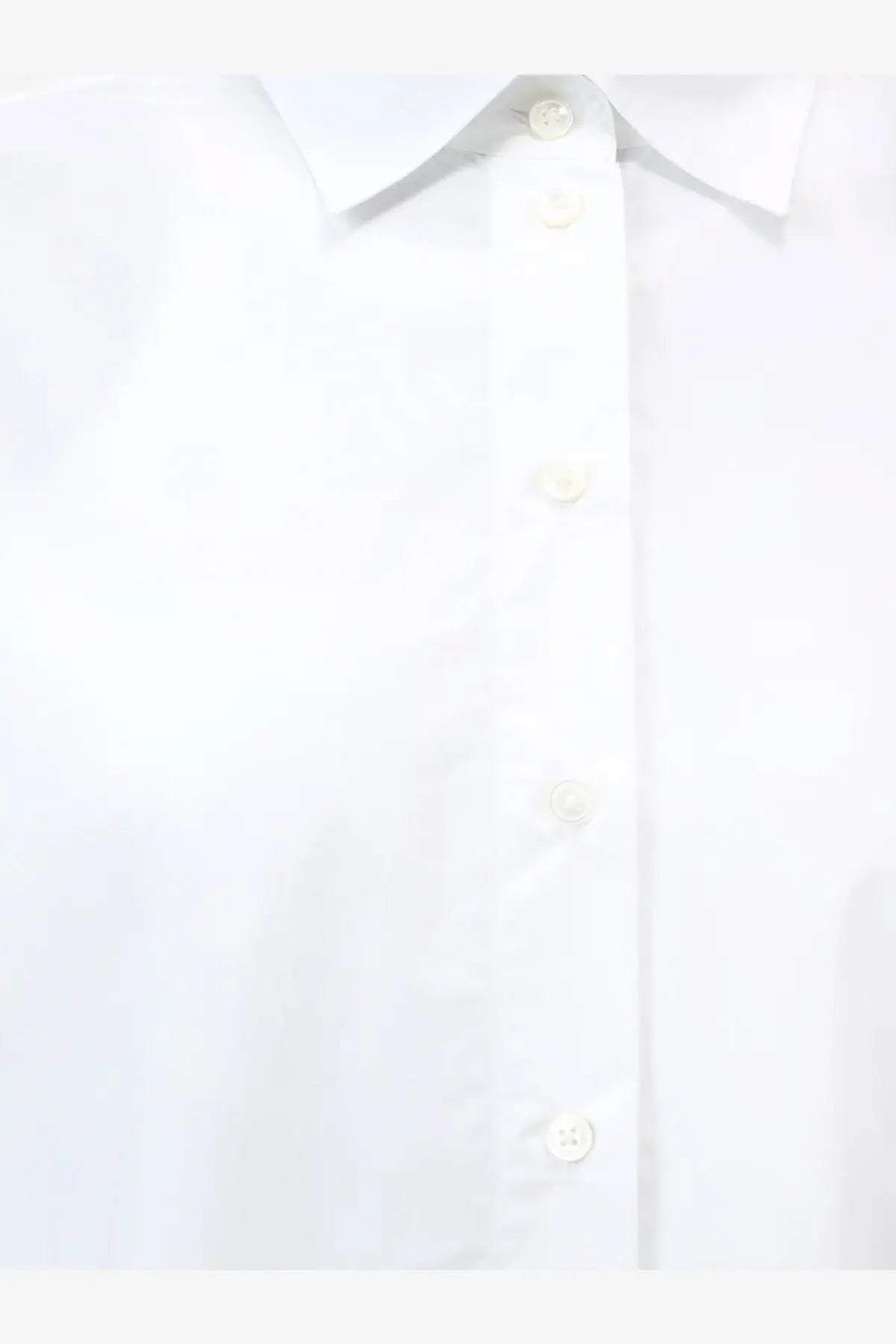 White closed women’s cotton button-down shirt with a crisp collar and matching buttons