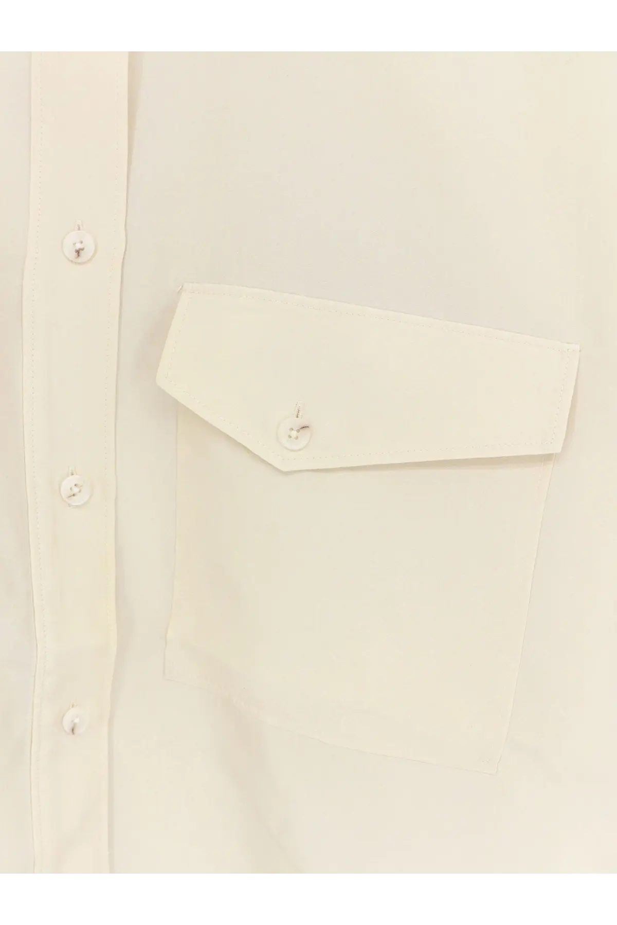 Cream-colored closed women’s cropped silk shirt with flap pocket and matching buttons in white color