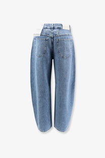 Back view of closed women’s jazzie blue light-wash denim jeans with wide-leg tapered silhouette and classic pockets