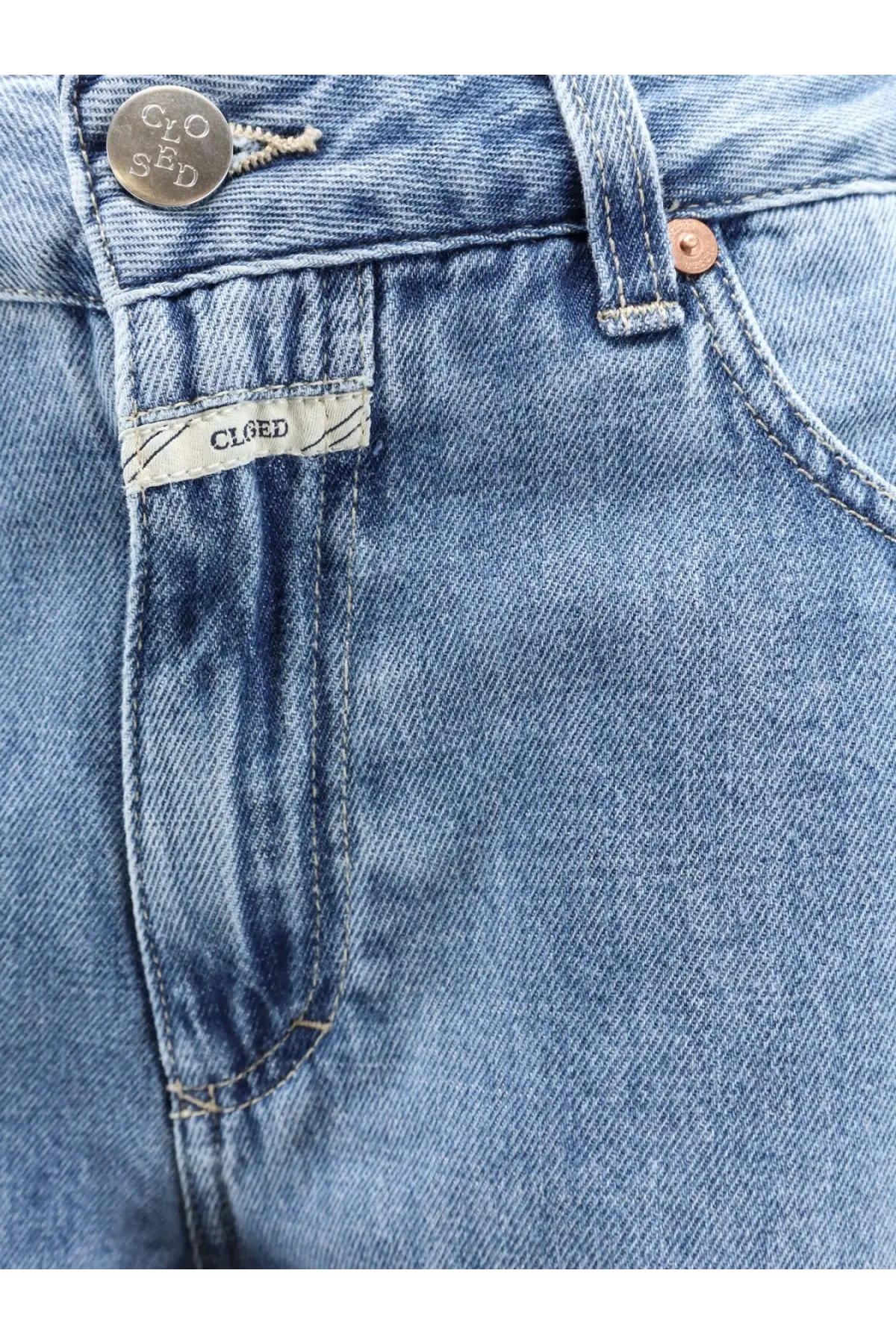 Closed women’s Jazzie blue denim jeans with silver button copper rivet and brand label on waistband
