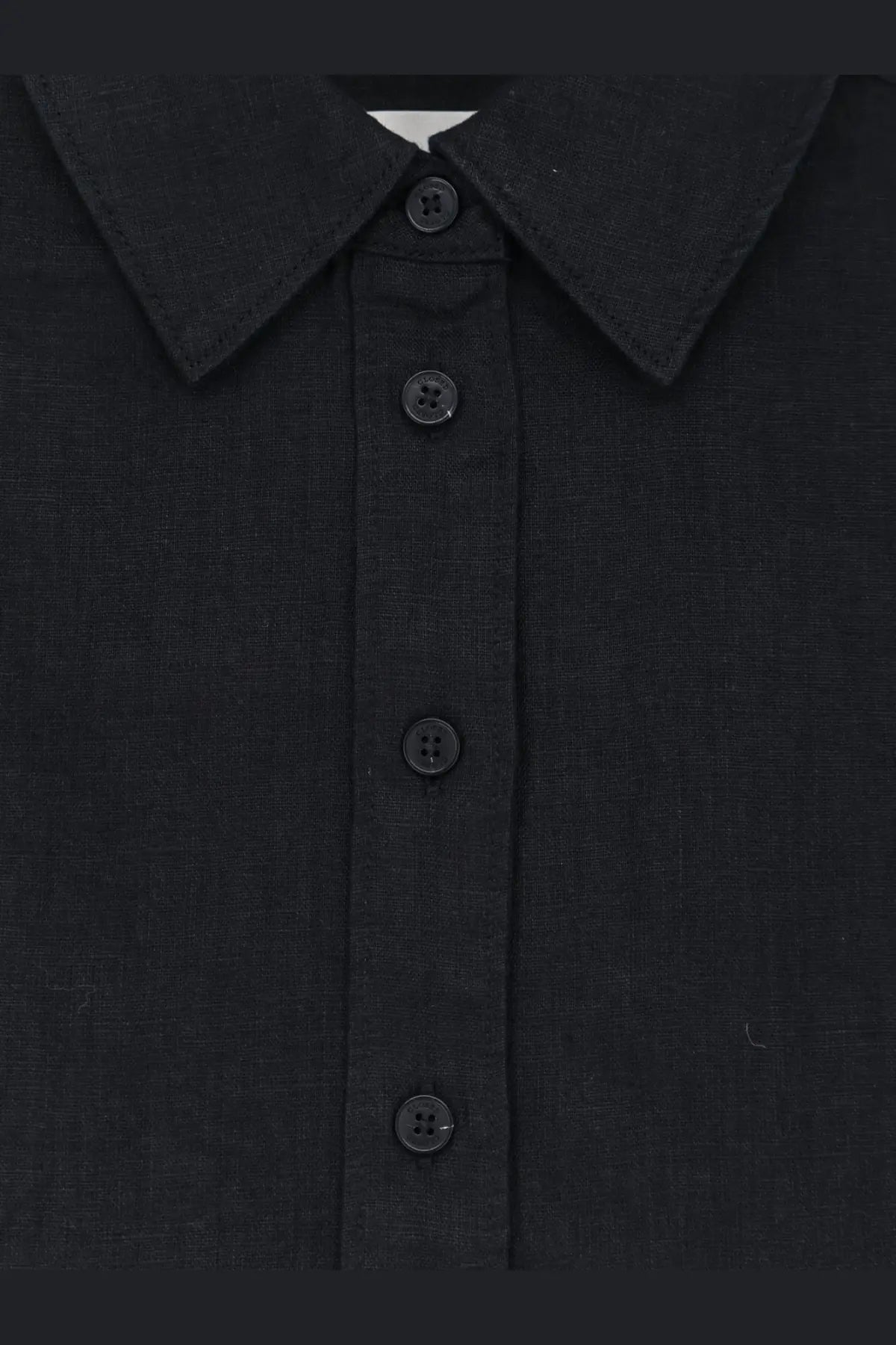Closed women’s linen shirt black featuring textured linen fabric and matching black buttons in a button-up style