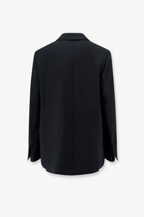 Black tailored closed women’s virgin wool blend blazer with minimalist design and subtle sheen