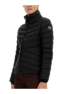 Colmar women’s black quilted down jacket with high collar and iconic circular logo on left sleeve