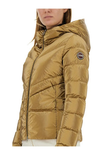 Colmar women’s gold quilted down puffer jacket with hood and black zipper for cold weather wear
