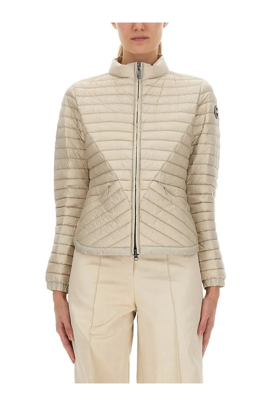 Colmar women’s lightweight beige quilted puffer jacket with high collar and front zipper made of down material