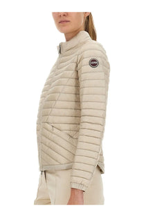 Beige quilted lightweight down jacket with high collar and colmar logo patch on sleeve for women