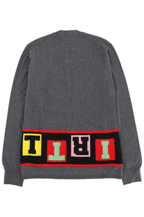 Back of a comme des garcons shirt men’s grey knit cardigan with colorful tiri lettering band across lower back