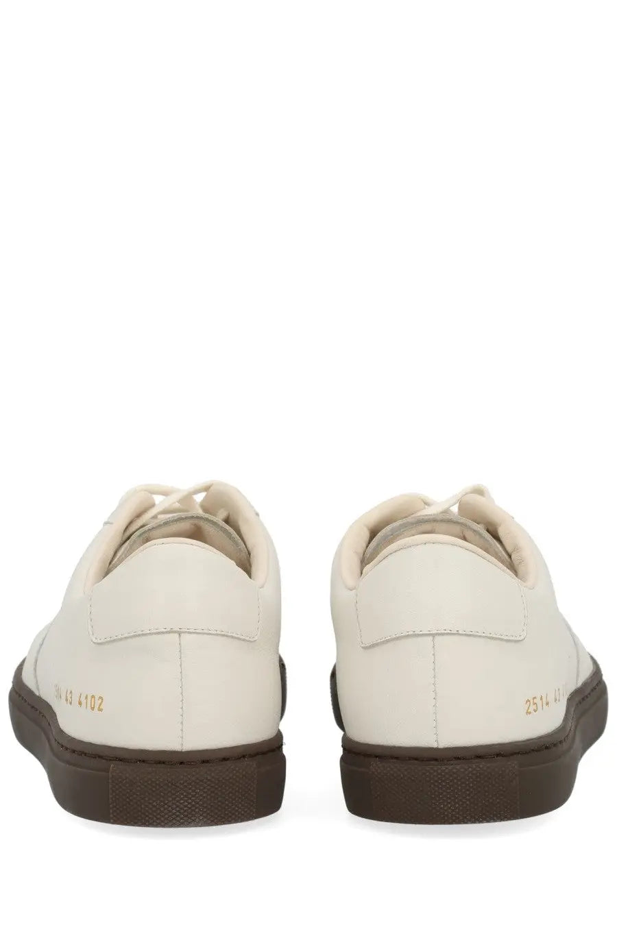 Common projects men’s bball slim sneaker white cream leather with dark brown rubber soles and gold-tone heel branding back view