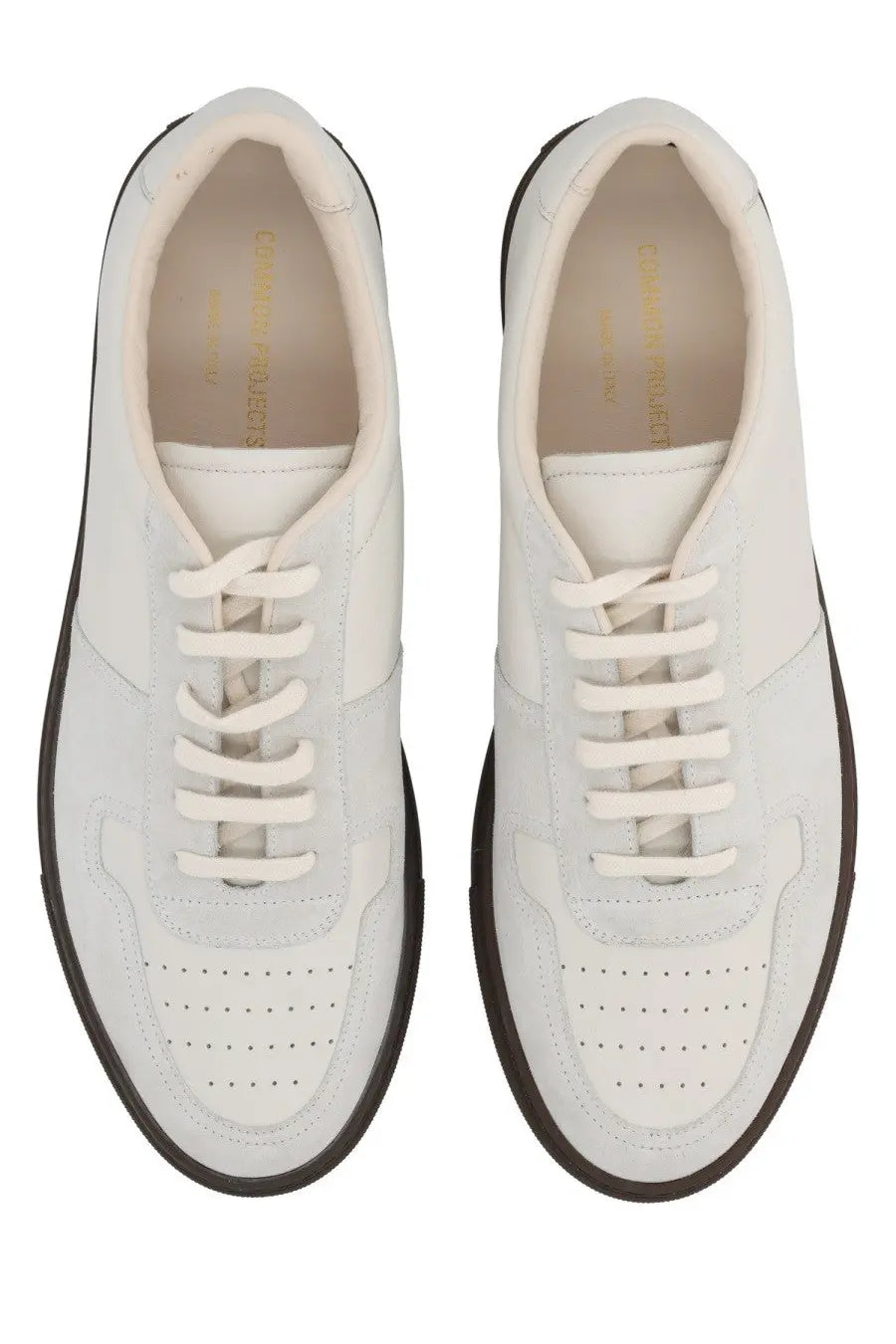 Common Projects men’s bball slim sneaker in white leather with black rubber soles and perforated toe panels