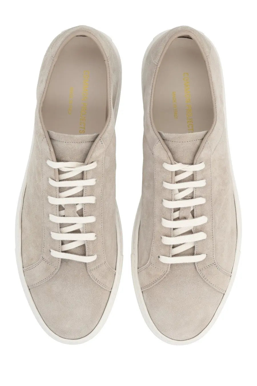 Common Projects men’s sneaker Achilles beige features beige suede low-top design with white laces and minimalist style