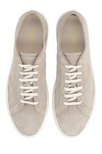 Common Projects men’s sneaker Achilles beige features beige suede low-top design with white laces and minimalist style