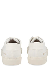 Common projects men’s sneaker achilles white showing the back side of white canvas sneakers with subtle heel branding